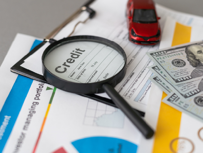 magnifying glass over credit reports